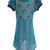 Turquoise green all-over printed A-line Tunic in Georgette fabric. Designed with a frilled round neck and puff sleeves. Embellished with karchupi at the top front. Single button opening at the back. Unlined.