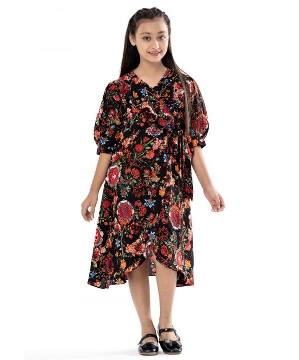 Black retro-wrap style frock in printed Georgette fabric. Designed with a V-neck and puff sleeves. Extended waving ruffle at the front.