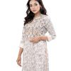 White all-over printed straight-cut Kameez in Crepe fabric. Features a low mock neck and three-quarter sleeves. Embellished with embroidery at the front. Unlined.
