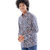 Blue casual shirt in printed Cotton fabric. Designed with a Classic collar and roll up sleeves.