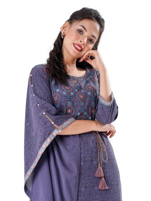 Gray all-over printed kaftan style Tunic in Georgette fabric. Designed with a round neck and three-quarter sleeves. Embellished with embroidery at the top front. Tasseled tie-cord closing at the front.
