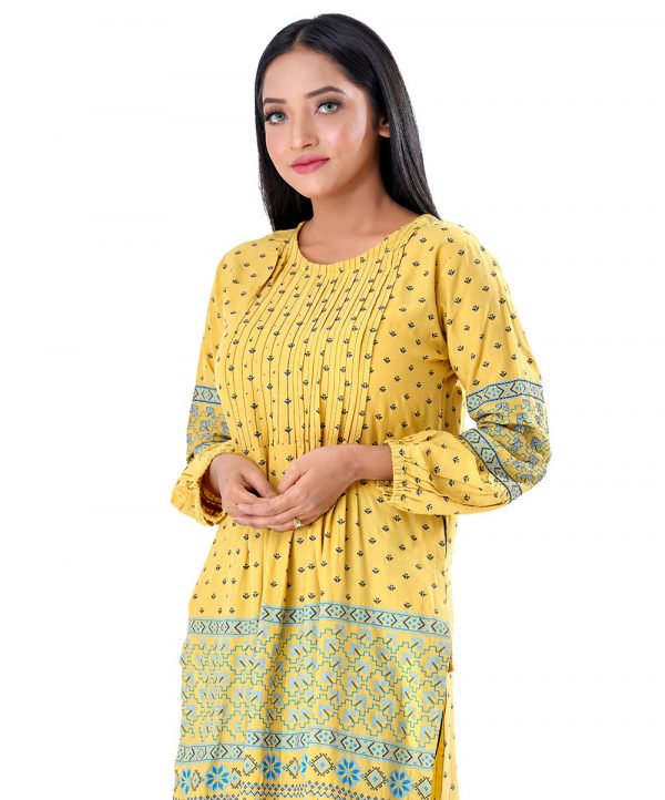 Yellow all-over printed straight-cut Tunic in Georgette fabric. Designed with a round neck and bishop sleeves. Embellished with pin tucks at the top front.