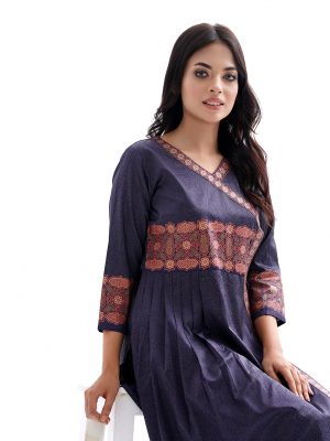 Navy blue all-over printed Kameez in Crepe fabric. Designed with a V-neck and three-quarter sleeves. Embellished with printed patches at the front and pleats from the waistline. Tasseled tie-cord closing at the one side.