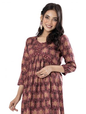 Copper rose all-over printed A-line Tunic in Crepe fabric. Designed V-neck and three-quarter sleeves. Embellished with printed patch attachment at the front, cuffs and hemline. Gathered at the front.