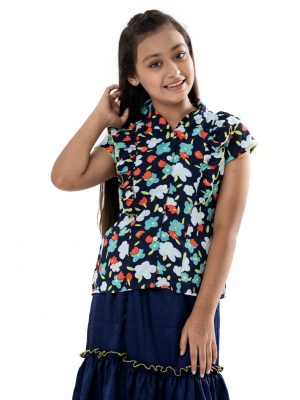 Navy Blue Top-Skirt set in printed Georgette fabric. The top features a band neck with buttons opening at the front and cap sleeves. Extended ruffles at the front. Paired with a gathered skirt as the bottom.
