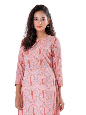 Peach all-over printed straight-cut Kameez in Georgette fabric. Features a round tie-cord neck and three-quarter sleeves. Designed with patch attachment at the hemline. Unlined.