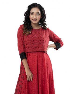 Red all-over printed layered Gown in Georgette fabric. Designed with a round neck and three-quarter sleeves with buttoned cuffs. Embellished with karchupi at the top front.