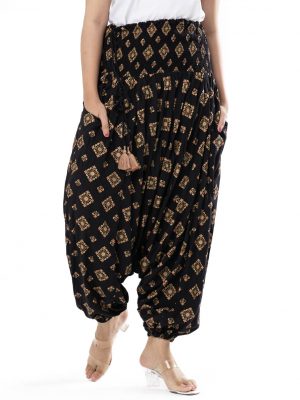 Black all-over printed Harem pants in Viscose fabric. Designed with smoked waistline with adjustable tasseled waist cords and side packets.