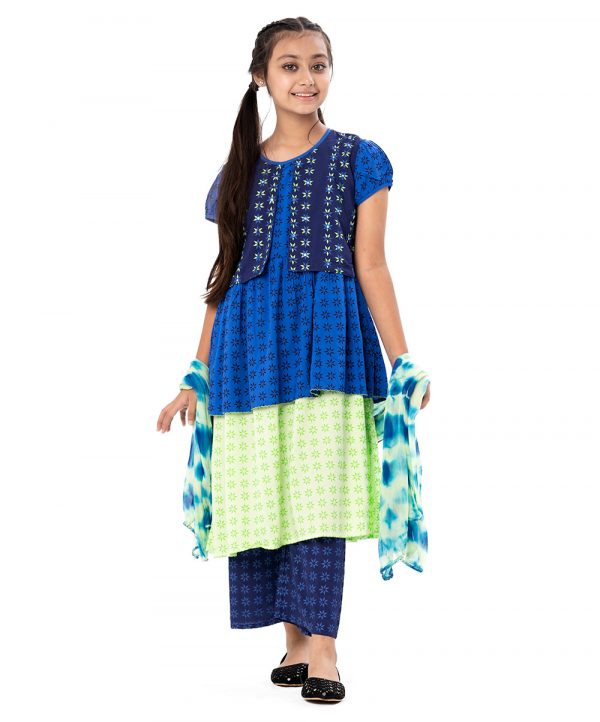 Blue and Green all-over printed Salwar kameez in Viscose fabric. The Koti-style kameez is designed with a round neck and bishop sleeves. Embellished with embroidery at the top front. Complemented by palazzo pants and a chiffon dupatta
