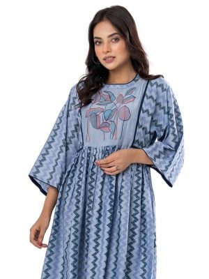 Blue all-over printed gathered Tunic in Cotton-blend fabric. Designed with a round neck and kimono sleeves. Embellished with embroidery at the top front. Button opening at the back.