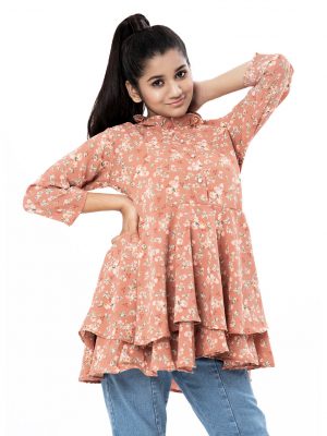 Peach layered A-line Tunic in printed Georgette fabric. Features a round neck with frills and three-quarter sleeves. Gathers from the waistline.