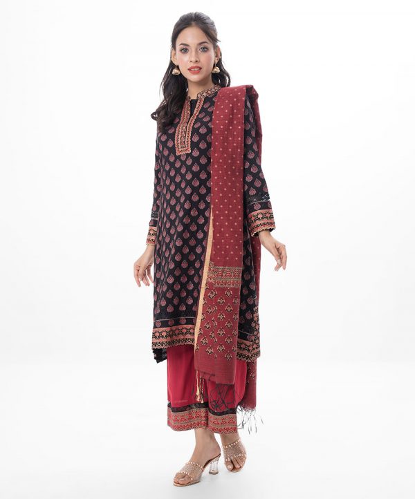 Black and maroon all-over printed Salwar Kameez in Viscose fabric. The Kameez is designed with a band neck with hook closure at the front and three-quarter sleeves. Embellished with embroidery at the top front and cuffs. Complemented by palazzo pants with matching patches on border lines and a half-silk dupatta.