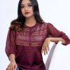 Maroon all-over printed A-line Top in Crepe fabric. Designed with a band neck and bishop sleeves. Embellished with karchupi at the top front.