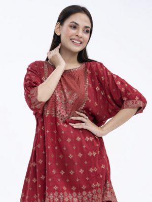 Red all-over printed A-line Tunic in Viscose fabric. Designed with a round neck and dropped sleeves. Embellished with karchupi at the top front. Gathers from the waistline. Single button opening at the back.