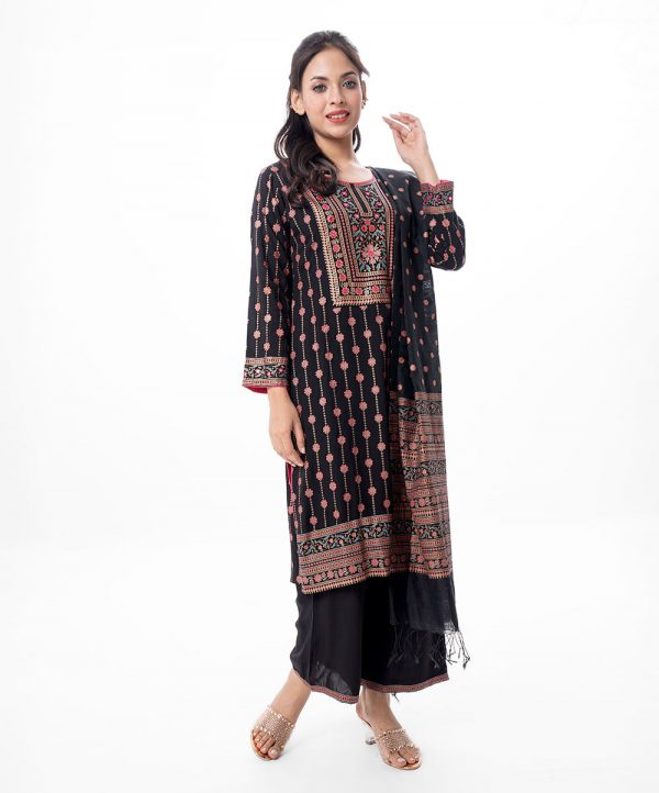 Black all-over printed Salwar Kameez in Viscose fabric. The Kameez is designed with a round neck and three-quarter sleeves. Embellished with karchupi at the top front and cuffs. Complemented by palazzo pants with matching patches on border lines and a half-silk dupatta.