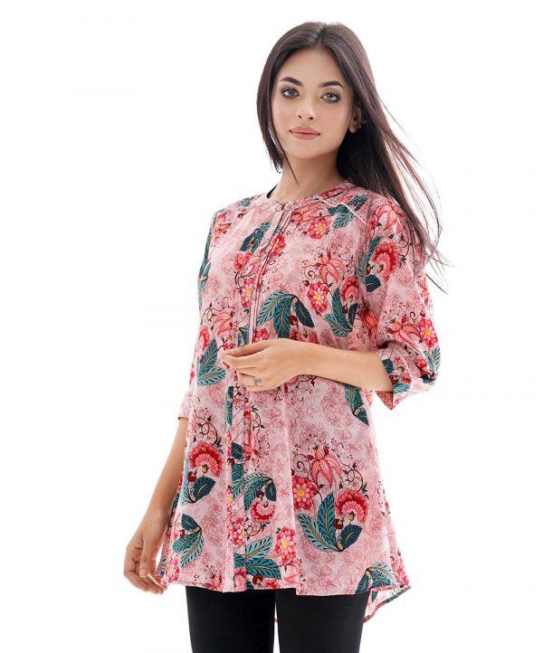Pink A-line ladies' Shirt in printed Georgette fabric. Designed with a band neck with hook closure at the front and three-quarter sleeves. Embellished with pin tucks at the top front. lace attachment at the front and cuffs.