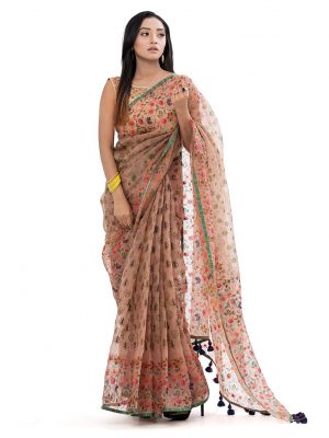 Rose Brown all-over printed exclusive Saree in Muslin fabric with a purple border. Embellished with karchupi, and decorative tassels on the achal.