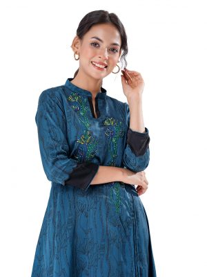 Blue all-over printed straight-cut Tunic in Crepe fabric. Designed with a band neck and three-quarter sleeves. Embellished with pin tucks and karchupi at the front.