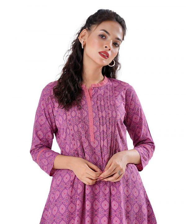 Pink all-over printed A-line Woven Top in Viscose fabric. Designed with a band neck and three-quarter sleeves. Embellished with pin tucks at the top front.