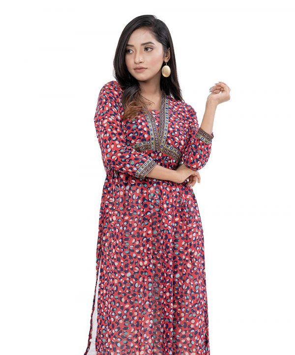 Red straight-cut Kameez in printed Georgette fabric. Designed with a kaftan neck and three-quarter sleeves. Printed patch attachment at the top front and cuffs. Pleats detailing at the front.