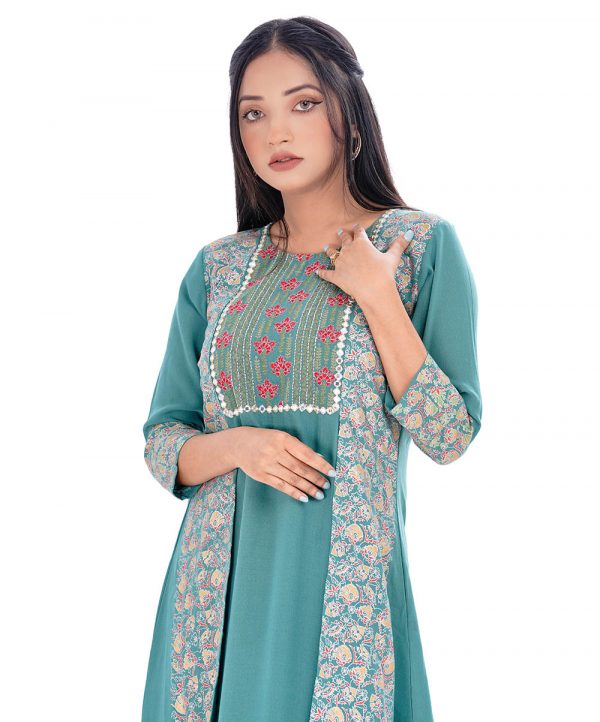 Green all-over printed shrug style Tunic in Georgette fabric. Designed with a round neck and three-quarter sleeves. Embellished with embroidery and pin tucks at the front. Elongated hemline. Unlined.