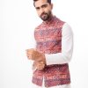 Maroon Waistcoat in printed Cotton fabric. Features a mandarin collar with a hidden button placket and Chest pocket. Taffeta lining in full body.