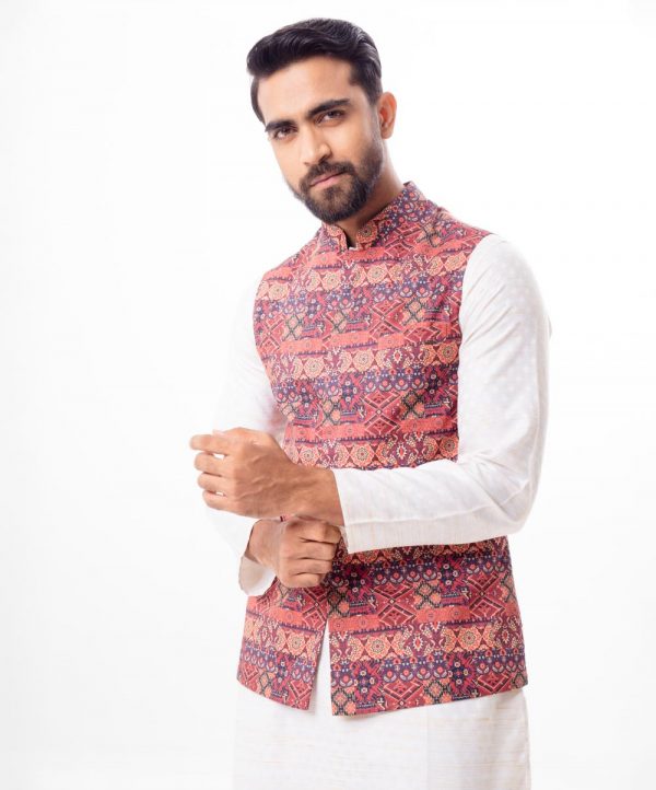 Maroon Waistcoat in printed Cotton fabric. Features a mandarin collar with a hidden button placket and Chest pocket. Taffeta lining in full body.