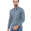 Blue casual shirt in paisley printed Cotton fabric. Designed with a classic collar and long sleeves with adjustable buttons at the cuffs. Slim fit.