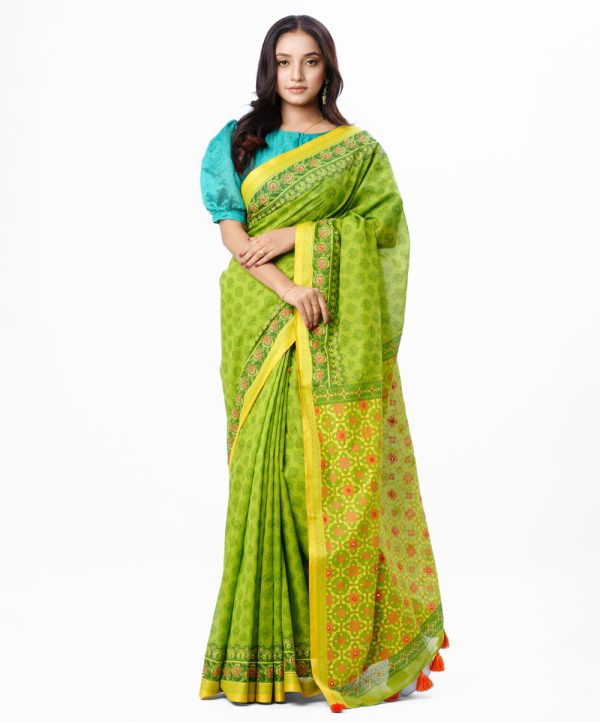 Green all-over printed Saree in Cotton fabric. Embellished with embroidery and decorative tassels on the achal.