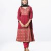 Maroon all-over printed retro-wrap style salwar kameez in Crepe fabric. The Kameez is designed with a V-neck and three-quarter sleeves. Corset cord at the front. Detailed with printed patch attachment at the front, cuffs and hemline. Complemented by culottes pants and printed chiffon dupatta.