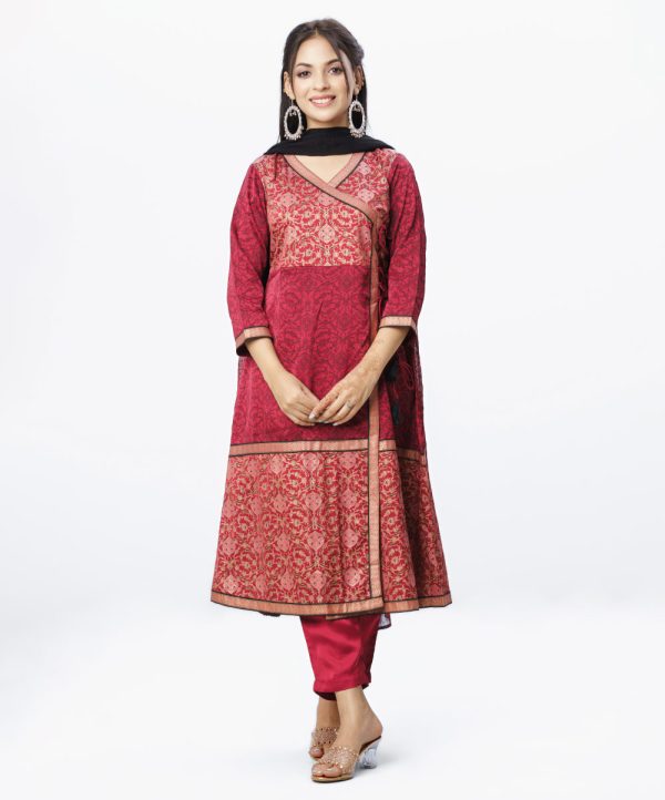 Maroon all-over printed retro-wrap style salwar kameez in Crepe fabric. The Kameez is designed with a V-neck and three-quarter sleeves. Corset cord at the front. Detailed with printed patch attachment at the front, cuffs and hemline. Complemented by culottes pants and printed chiffon dupatta.