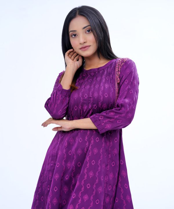 Purple all-over printed A-line Tunic in Crepe fabric. Designed with a low mock neck and three-quarter sleeves. Embellished with pin tucks at the top front and cuffs. Button opening at the back. Unlined.