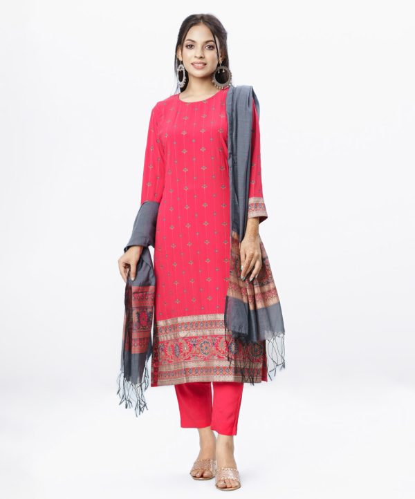 Red all-over printed Salwar Kameez in Georgette and Viscose fabric. The georgette Kameez features a round neck and three-quarter sleeves. Embellished with karchupi at the front and cuffs. Single button opening at the back. Complemented by culottes pants and printed half-silk dupatta.