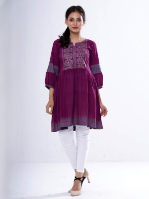 Purple Tunic in printed Georgette fabric. Designed with a round neck and lantern sleeves. Embellished with patch attachment at the top front and gathers from the waistline. Unlined.