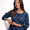Navy blue all-over printed A-line Tunic in Viscose fabric. Designed with a round neck with tasselled tie-cord and bishop sleeves. Embellished with lace attachment at the front and cuffs. Gathers from the waistline.