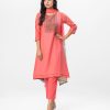 Cotton blended A-Line style Salwar Kameez. Three-quarter sleeved, karchupi with beads. Tie-dye printed chiffon dupatta with pant-style pajamas.