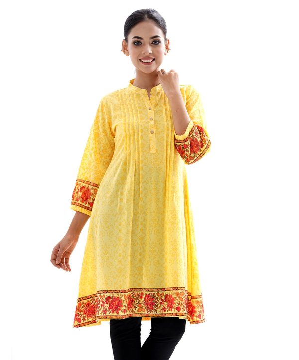 Yellow all-over printed A-line Tunic in Georgette fabric. Features a band neck with button opening at the front and three-quarter sleeves. Details with pin tucks at the front.