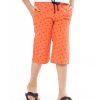 Coral orange all-over printed three-quarter pants in twill Cotton fabric. Five pockets, Covered elastic with adjustable drawstring at hemline & zipper fly.