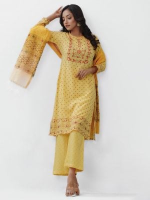 Yellow all-over printed Salwar Kameez in Viscose fabric. The Kameez is designed with a low mock neck and three-quarter sleeves. Embellished with embroidery at the top front. Button opening at the back. Complemented by palazzo pants and a half-silk dupatta.