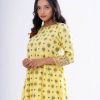 Yellow all-over printed A-line Maternity Tunic in Viscose fabric. Designed with a round neck and three-quarter sleeves. Embellished with embroidery at the top front and box pleats from the waistline.