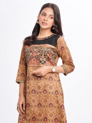 Brown all-over printed A-line Kameez in Crepe fabric. Designed with a low mock neck and three-quarter sleeves. Sequined net details and karchupi at the top front. Printed patch attachment at the cuffs. Single button opening at back.