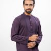 Purple premium Panjabi in Cotton fabric. Designed with a mandarin collar and matching metal buttons on the placket. Embellished with karchupi at the top front.