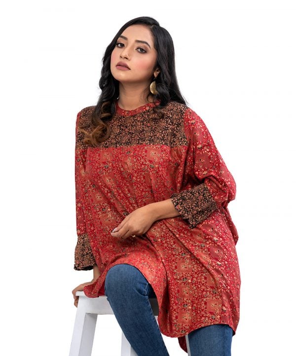 Maroon all-over printed kaftan style tunic in Viscose fabric. Designed with a band neck and Batwing sleeves. Smoked detailing at the top front and cuffs. Button opening at the back.