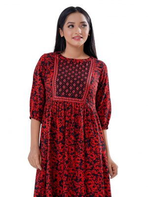 Maroon and Black Tunic in Printed Georgette fabric. Designed with a low mock neck and bishop sleeves. Embellished with embroidery at the top front and gathers from the waistline. Single button opening at the back. Unlined.