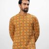 Mustard Yellow all-over printed semi-fitted Panjabi in slab Viscose fabric. Designed with a mandarin collar and hidden button placket.