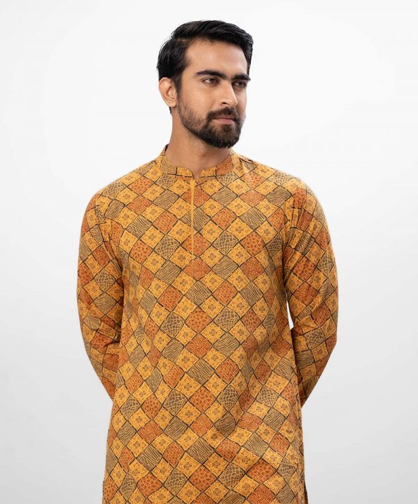 Mustard Yellow all-over printed semi-fitted Panjabi in slab Viscose fabric. Designed with a mandarin collar and hidden button placket.