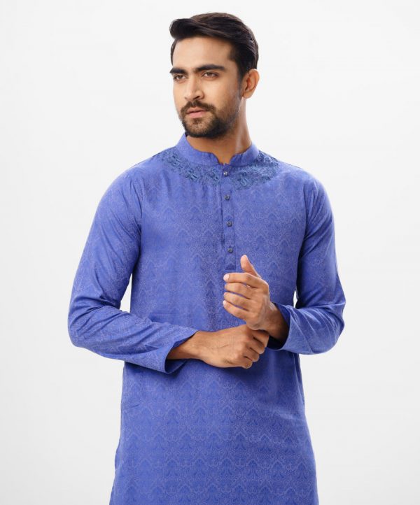 Blue fitted Panjabi in Jacquard Cotton fabric. Designed with a mandarin collar and matching metal buttons on the placket. Embellished with karchupi at the top front.