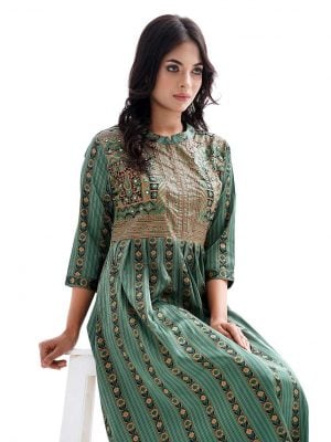 Green all-over printed A-line Tunic in Crepe fabric. Features a band neck with hook closure at the front, and three-quarter sleeves. Embellished with embroidery at the top front and pleats from the waistline. Unlined.