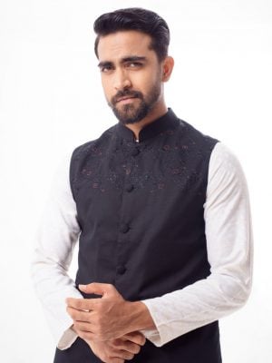 Black Waistcoat in Cotton fabric. Features a mandarin collar with front button fastening. Embellished with embroidery at the front. Taffeta lining in full body.