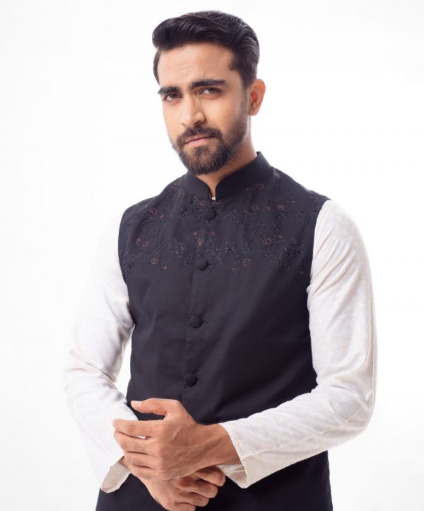 Black Waistcoat in Cotton fabric. Features a mandarin collar with front button fastening. Embellished with embroidery at the front. Taffeta lining in full body.